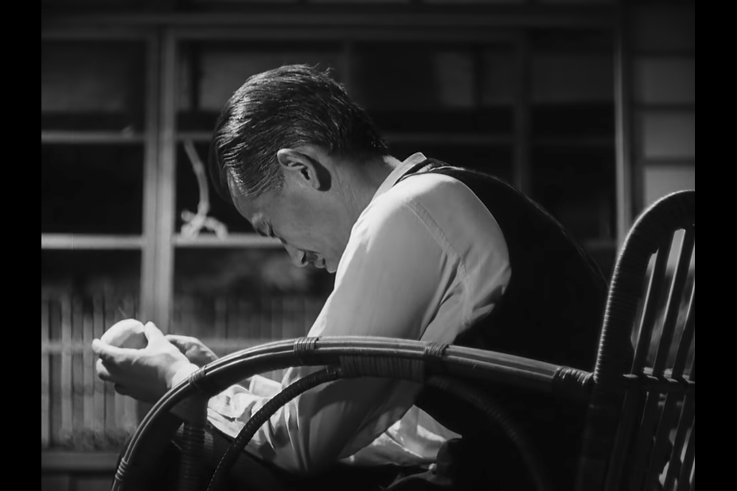 What the Peel Knows: Professor Somiya sits alone in his house, peeling an apple. The peel breaks, and he lowers his head in a gesture of profound loss.